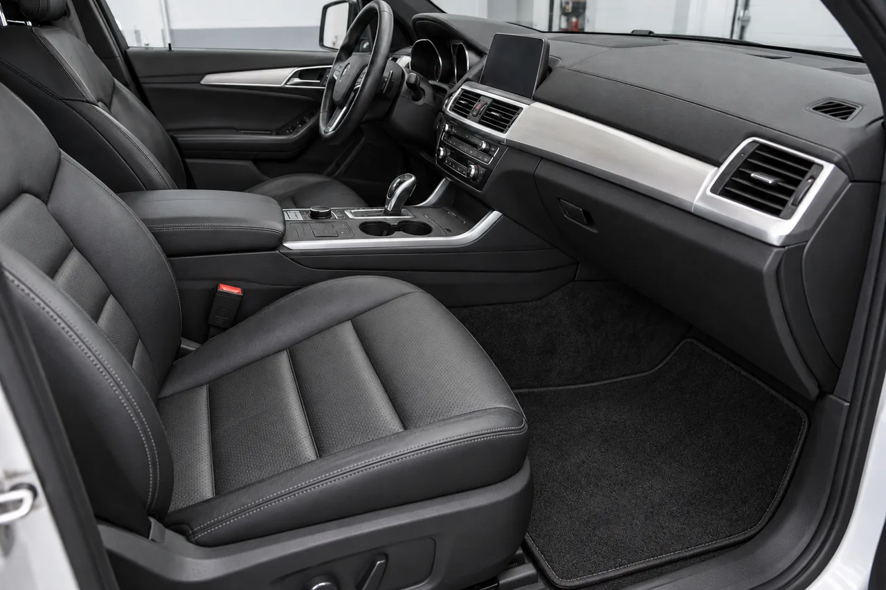 Clean black leather seats and cabin surfaces after interior recovery