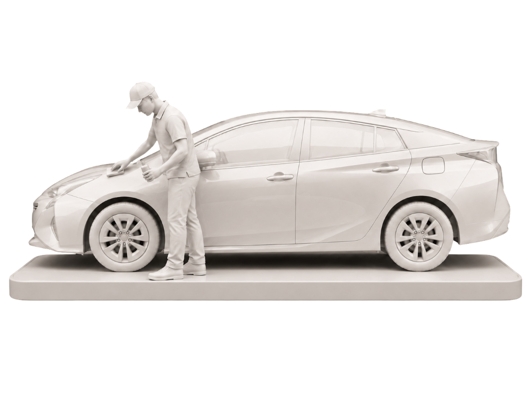 Detailing technician applying ceramic coating to a vehicle